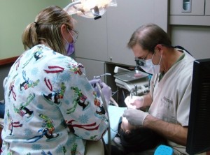 Dr. Leonard checking a patient
