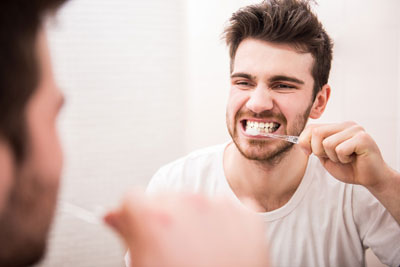 Man brushing teeth